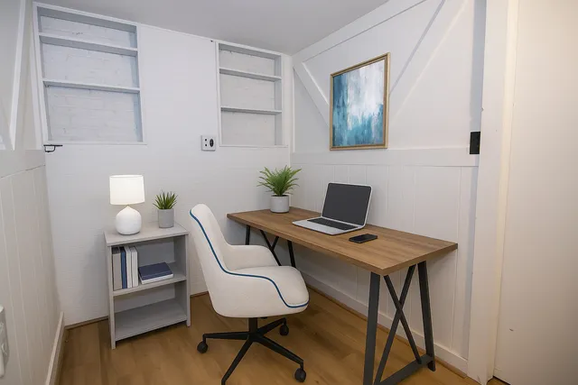 a workspace with furniture and wooden floor