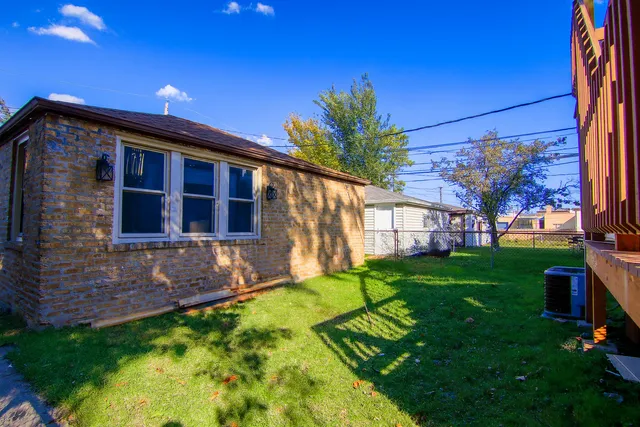 a view of front of house with a yard