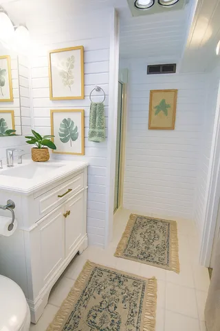 a bathroom with a sink a vanity and a window