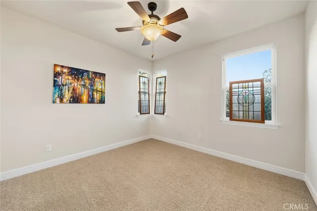 a view of a patio with a table and chairs and potted plants