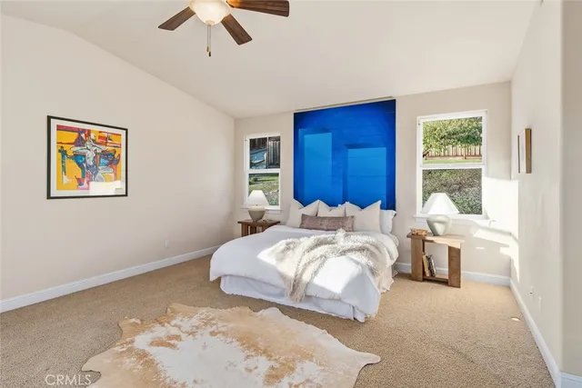 a bedroom with bed and a window