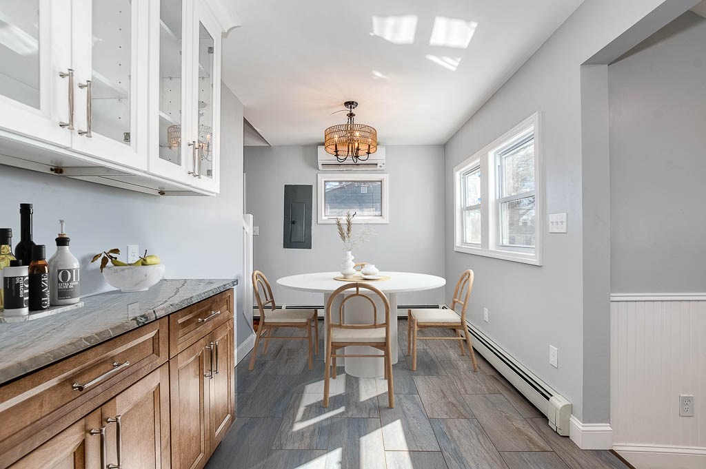 43 Shore Avenue Wareham, MA 02571 - Photo 14 of 40 a view of a kitchen counter space a sink wooden floor and living room view