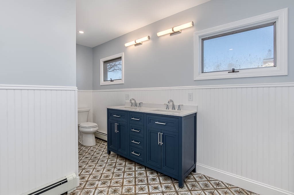 43 Shore Avenue Wareham, MA 02571 - Photo 28 of 40 a bathroom with a sink a mirror and a toilet