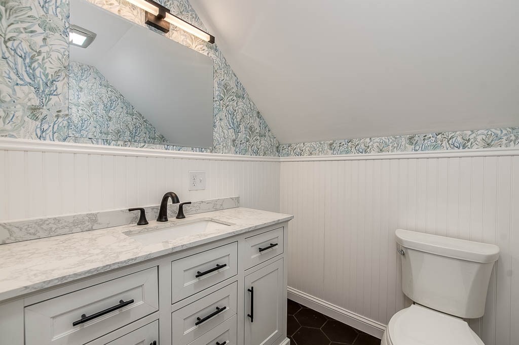 43 Shore Avenue Wareham, MA 02571 - Photo 29 of 40 a bathroom with a toilet sink and mirror