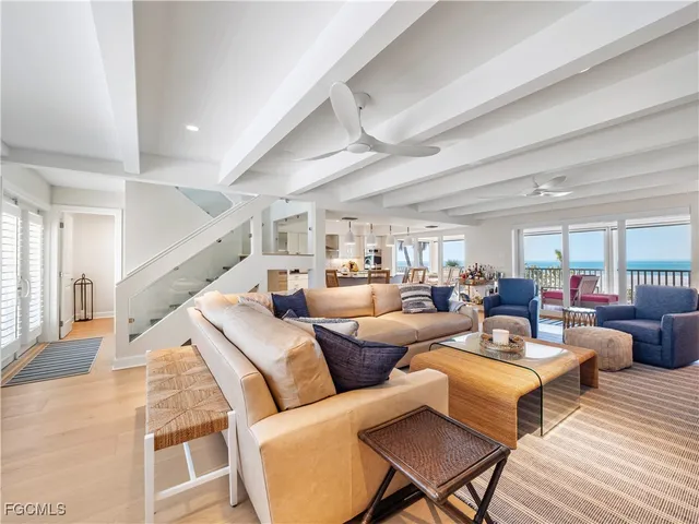 a large bedroom with a bed and a large window