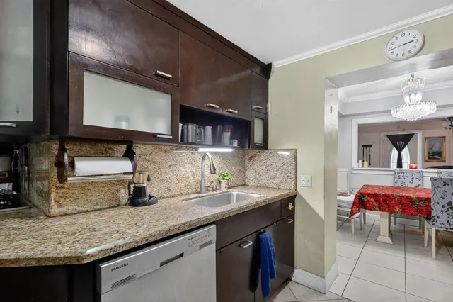 a bath room with sink and mirror