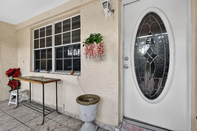 a view of a door and chair in a room