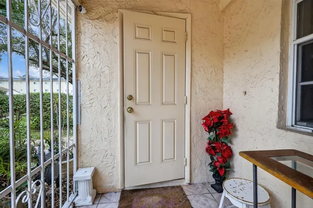 a kitchen with granite countertop a sink and a stove