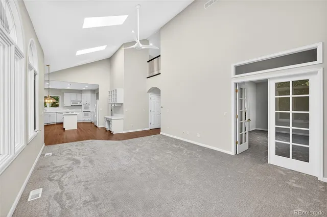 a view of a kitchen with furniture and windows
