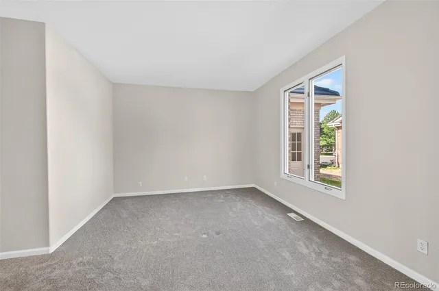 a bathroom with a toilet a sink and a mirror