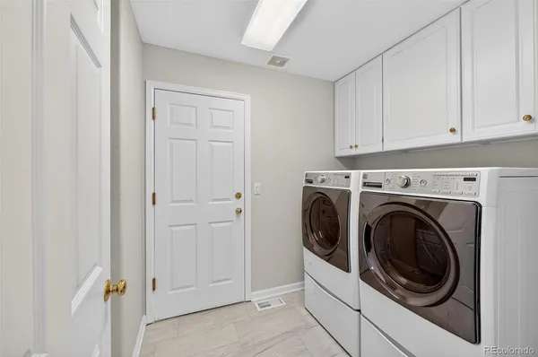 a bathroom with a sink and cabinets