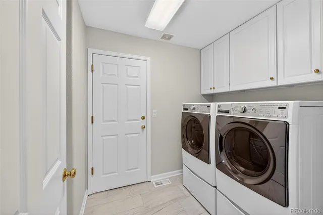 a bathroom with a sink and cabinets
