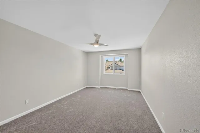 a bathroom with a double vanity sink a toilet and a mirror