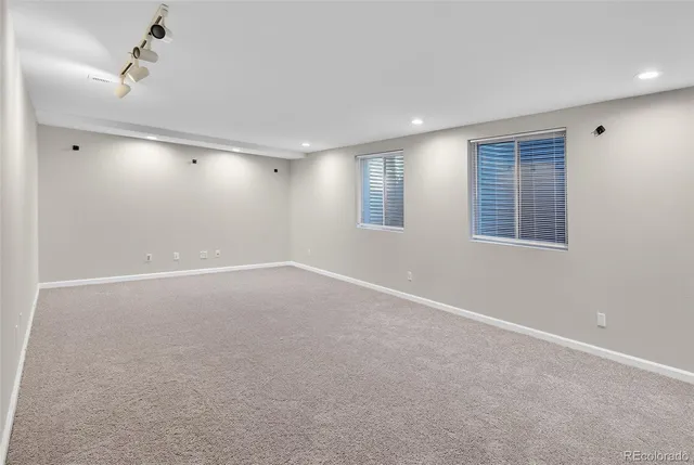 a utility room with wooden floor washer and dryer