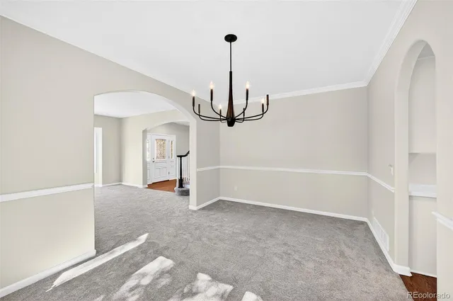 a view of empty room with ceiling fan