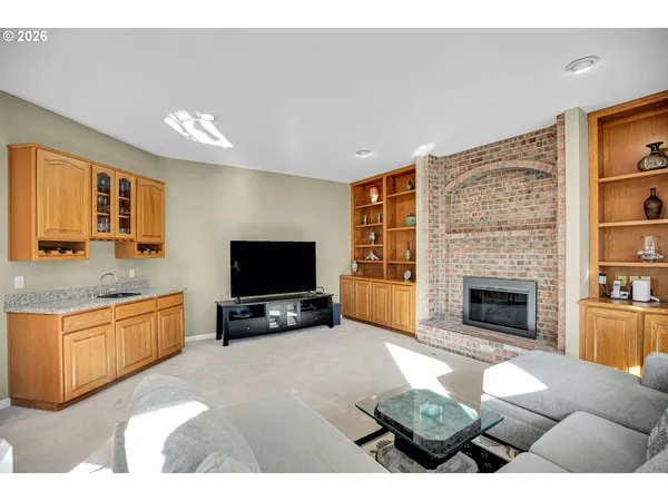 a dining room with furniture window and wooden floor