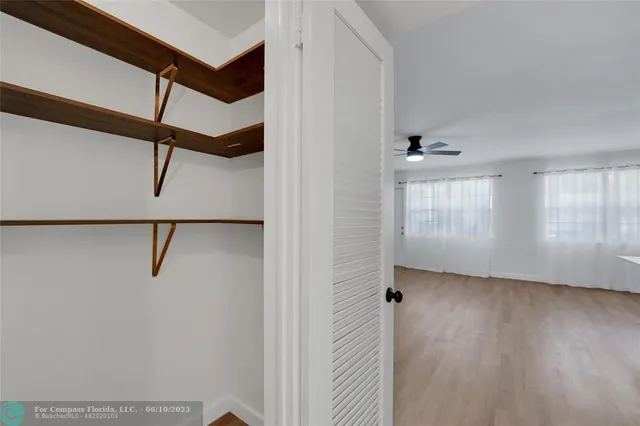 a view of an entryway with wooden floor
