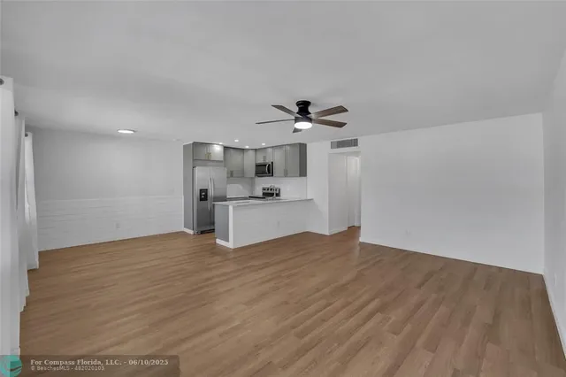 a view of kitchen with wooden floor