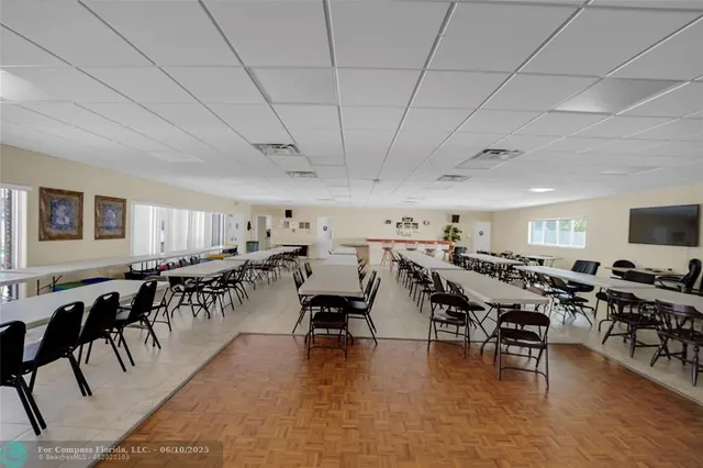 a view of a room with lots of wooden furniture