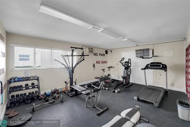 a room with gym equipment and window