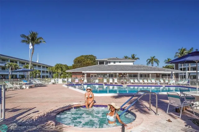 a view of a lake with a table and chairs