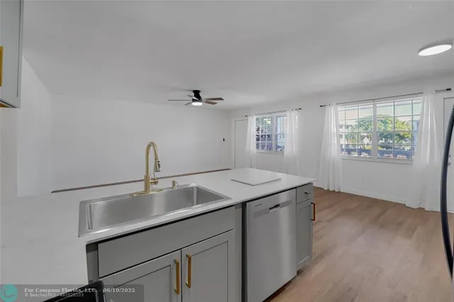 a view with a sink and a mirror