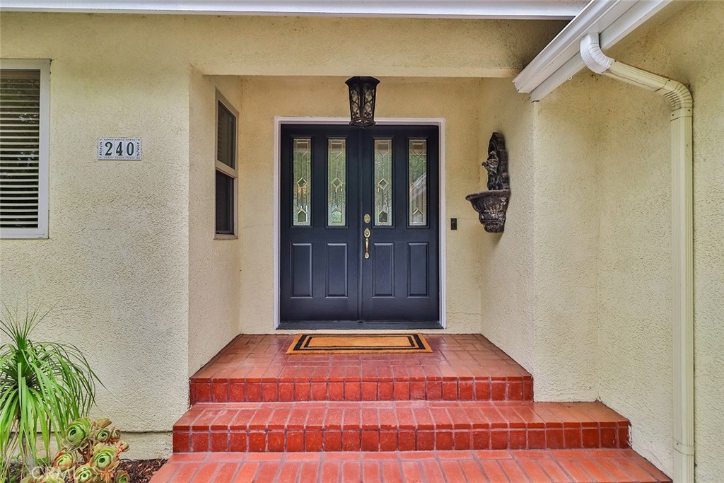 240 Portal Street Oak View, CA 93022 - Photo 20 of 75 a view of a hallway with wooden floor and a potted plant