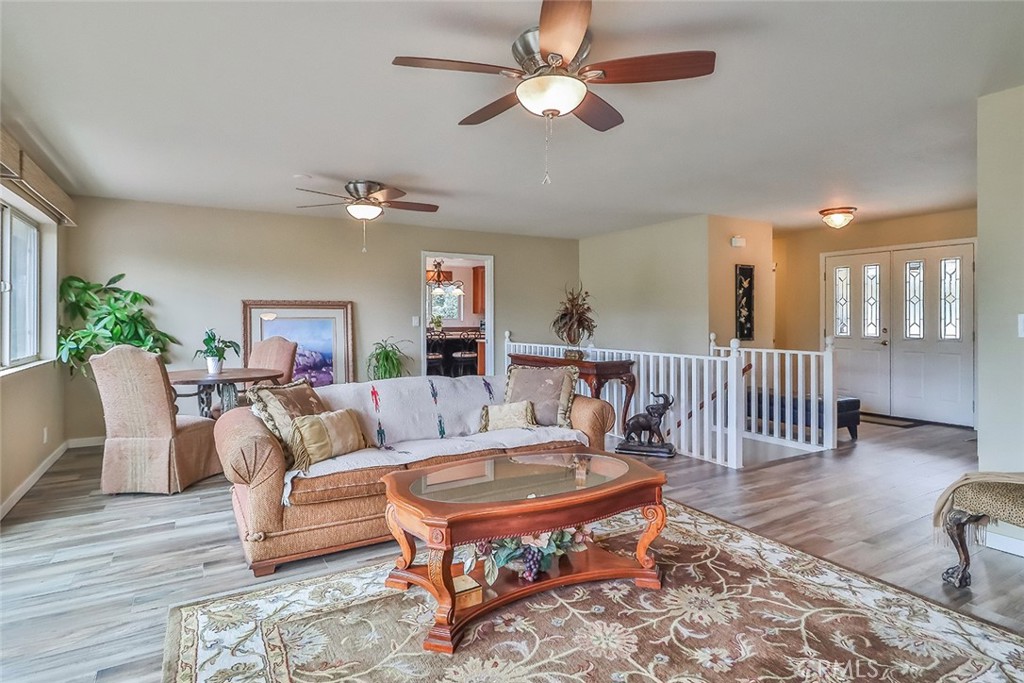 240 Portal Street Oak View, CA 93022 - Photo 27 of 75 a living room with furniture a chandelier and a rug