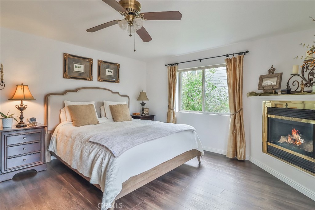 240 Portal Street Oak View, CA 93022 - Photo 43 of 75 a bedroom with a bed and a fireplace