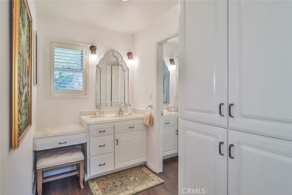 240 Portal Street Oak View, CA 93022 - Photo 46 of 75 a bathroom with a double vanity sink toilet mirror and window