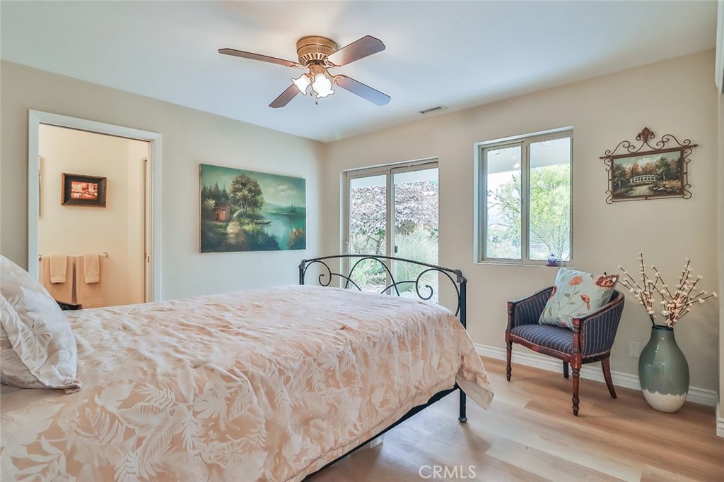 240 Portal Street Oak View, CA 93022 - Photo 55 of 75 a bedroom with a bed and a chair