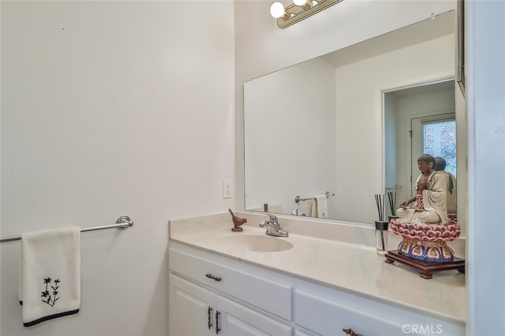 240 Portal Street Oak View, CA 93022 - Photo 60 of 75 a bathroom with a sink and a mirror