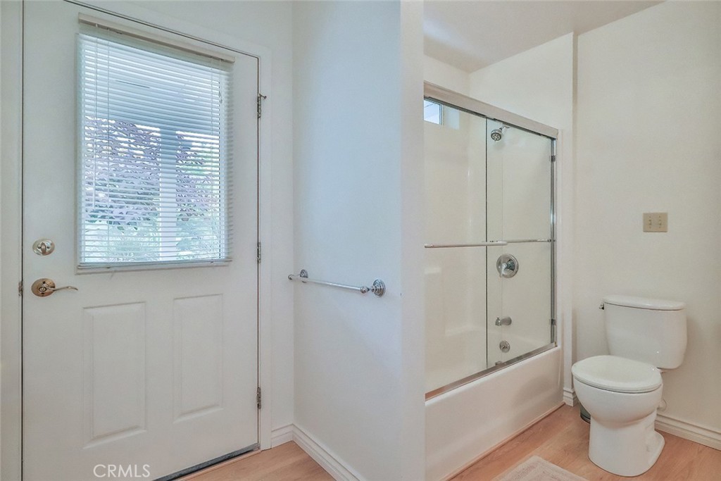 240 Portal Street Oak View, CA 93022 - Photo 61 of 75 a bathroom with a granite countertop toilet a sink and shower