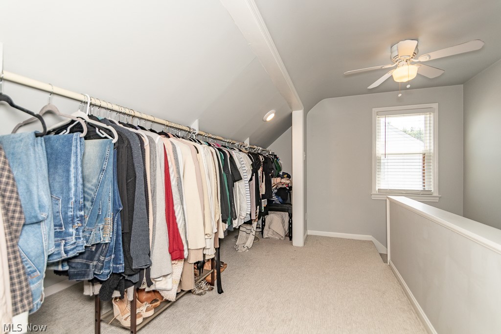 1314 Mayfield Ridge Road Cleveland, OH 44124 - Photo 25 of 40 Walk in closet featuring vaulted ceiling, carpet, and ceiling fan