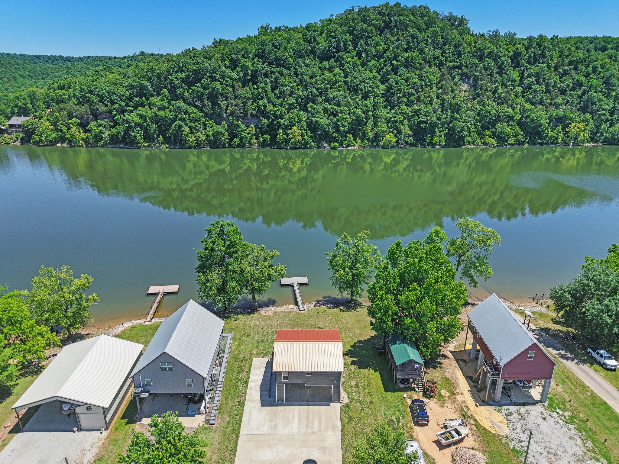 958 Pevahouse Camp Lane Decaturville, TN 38329 - Photo 22 of 32 an aerial view of a house with a garden and lake view