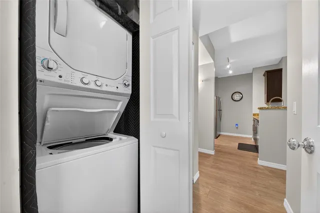 a view of bathroom with a toilet a sink and a mirror