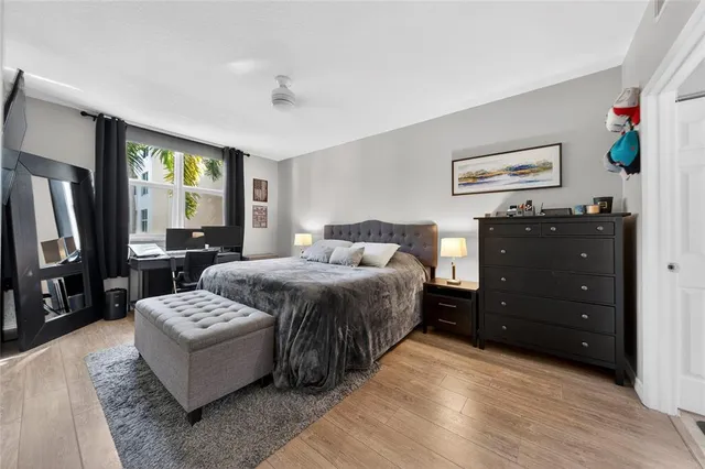 a bedroom with a bed and a dresser