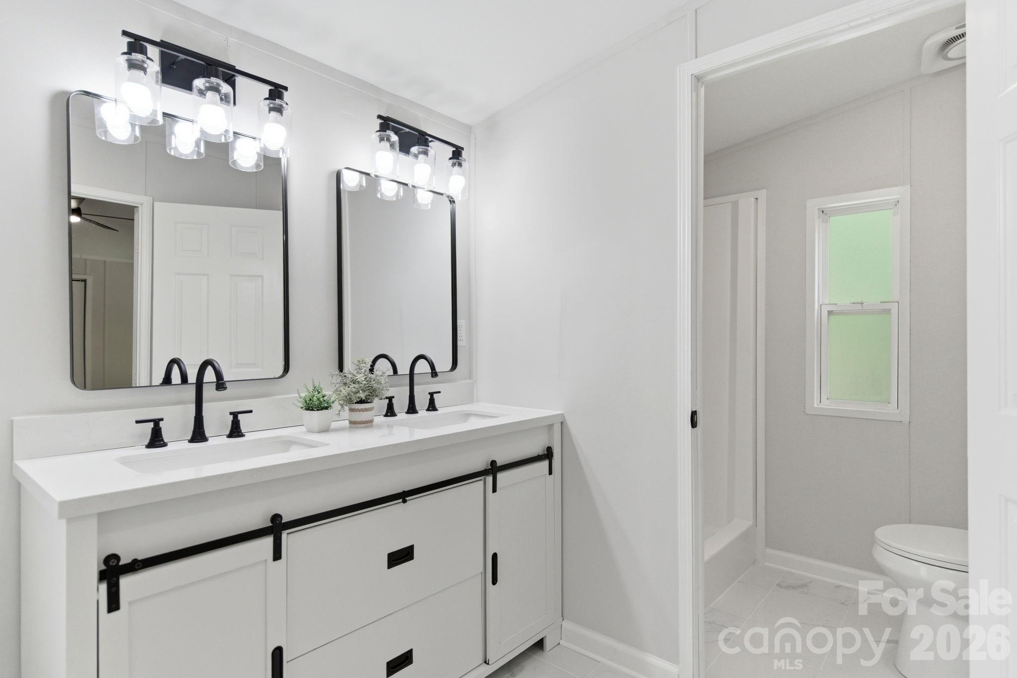 481 Harrell Road Burgaw, NC 28425 - Photo 14 of 25 a bathroom with a sink vanity and a mirror