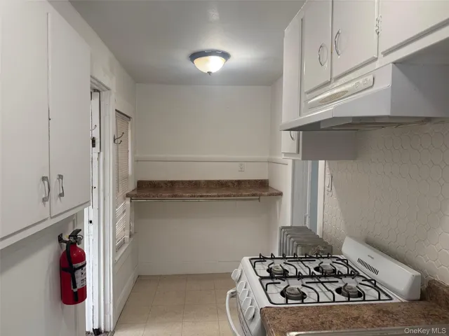 a kitchen with a stove and a refrigerator