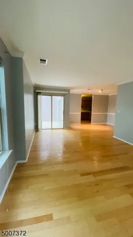 a view of an empty room with stairs
