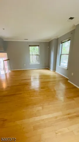 an empty room with a empty space and window