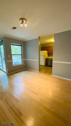 a view of kitchen with wooden floor