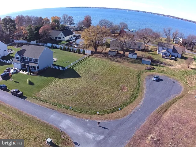 a view of a swimming pool with a yard and mountain view