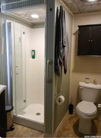 a living room with furniture a window and a rug