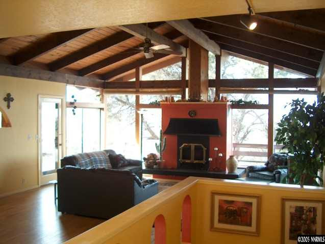 14630 Virginia Foothills Drive Reno, NV 89521 - Photo 3 of 9 a living room with furniture and a fireplace
