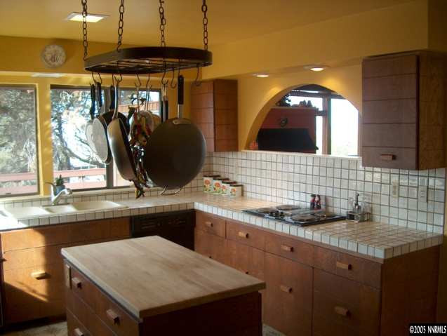 14630 Virginia Foothills Drive Reno, NV 89521 - Photo 8 of 9 a kitchen with a sink and a refrigerator