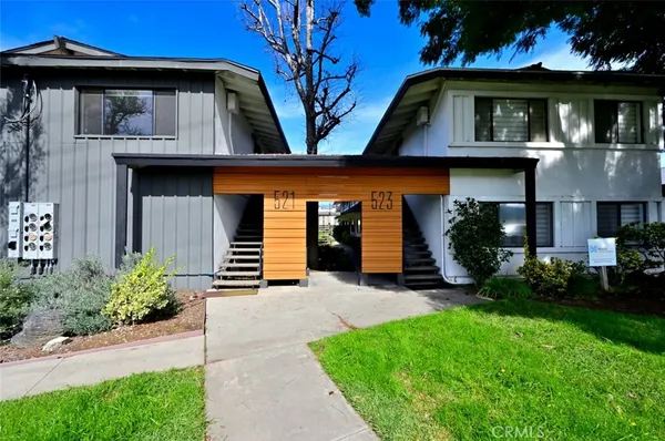 a view of a patio with a table and chairs