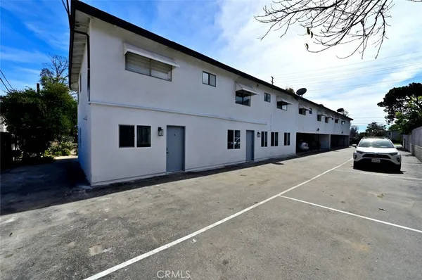 a view of a balcony with wooden stairs