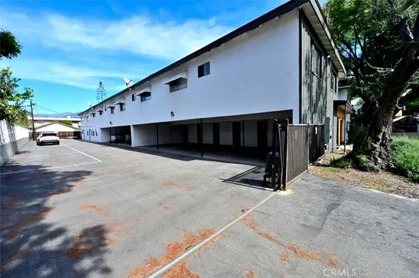 a view of a street with a building in the background