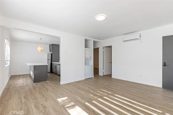a kitchen with stainless steel appliances a stove a sink and a refrigerator
